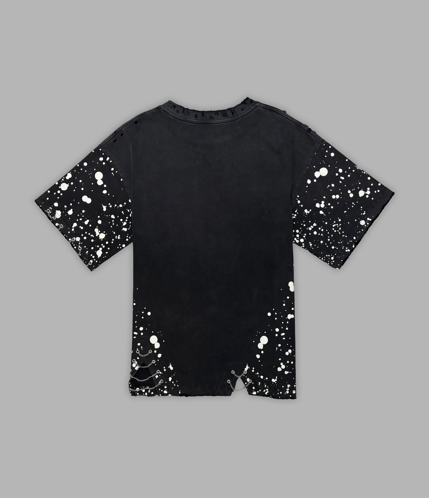 Black t-shirt with white splatter pattern on a gray background