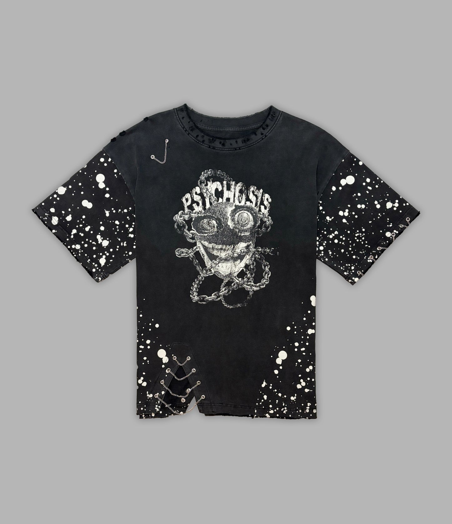 Black t-shirt with graphic design and splatter paint effect on a gray background