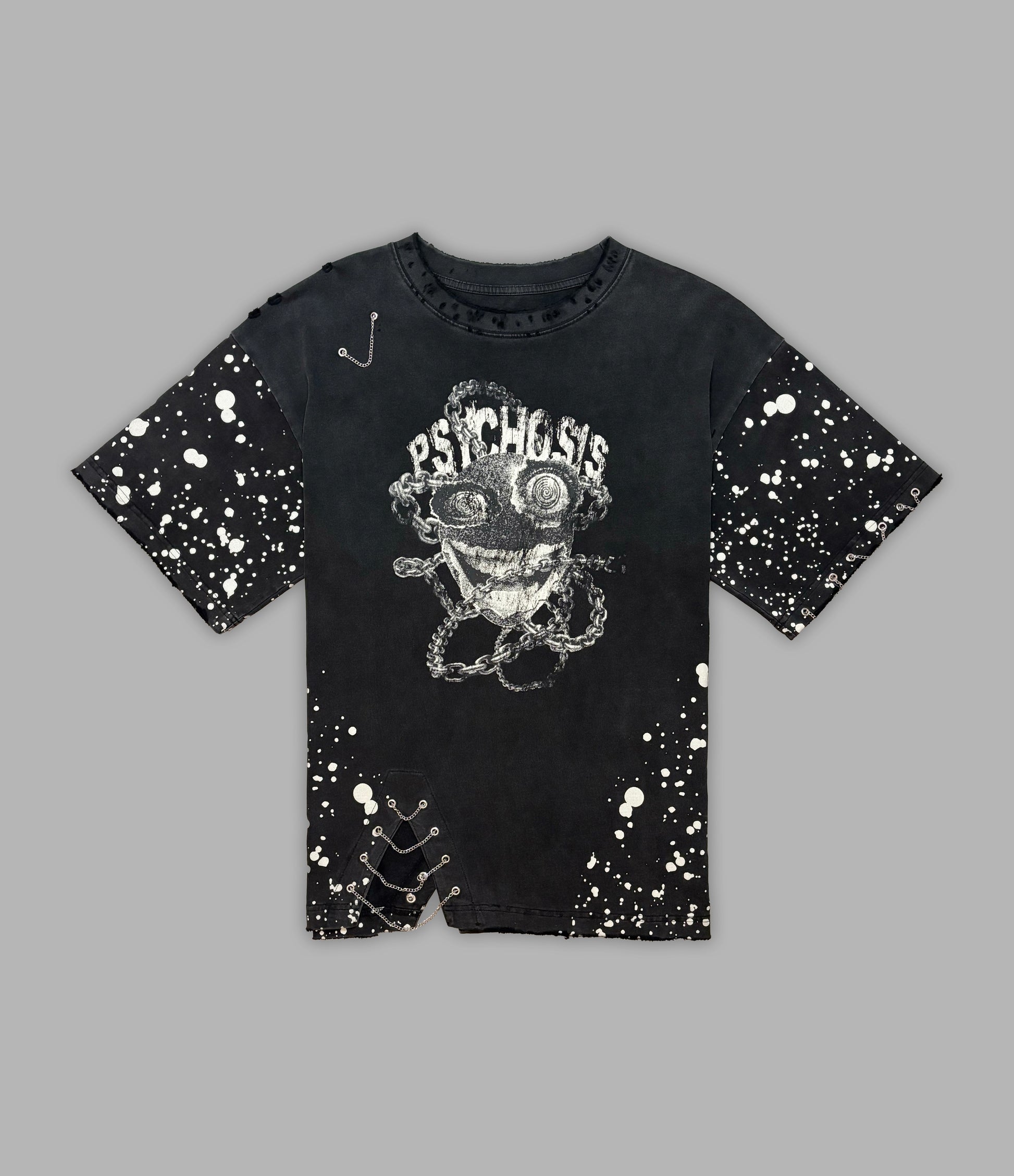 Black t-shirt with graphic design and splatter paint effect on a gray background