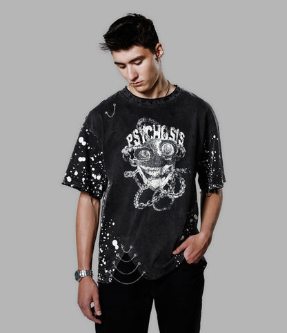 Person wearing a black t-shirt with 'Psychosis' design on a gray background